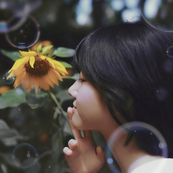 Avery Chen, Lead Design Curator at Moonlit Valley Network, reviewing corporate floral arrangements